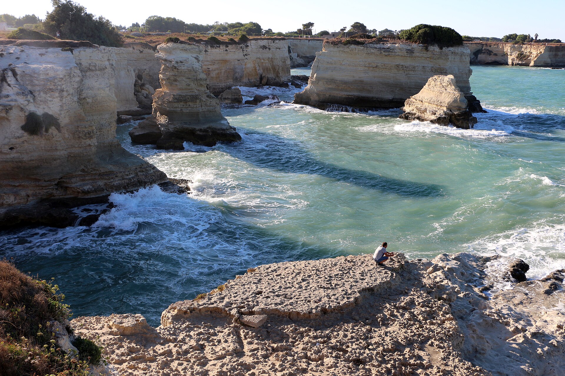 Limestone sea stacks and turquoise water at Torre Sant'Andrea